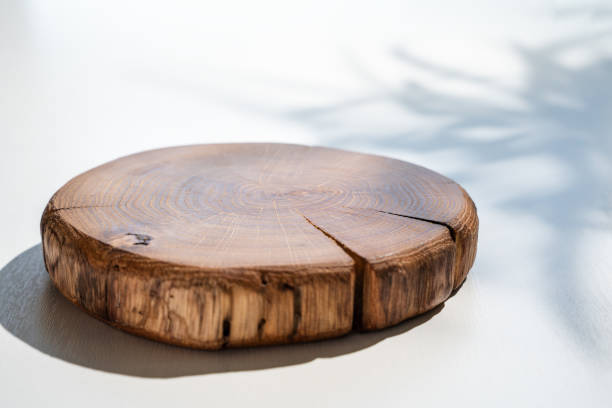 istock Rustic Wooden Podium on White Background with Plant Shadow 2180067165