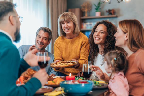 istock Family enjoy Thanksgiving lunch together 2180067829