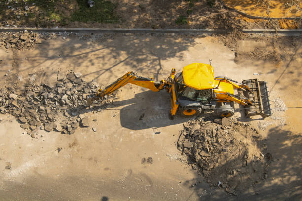 istock jackhammer on a loader for breaking up asphalt. road demolition 2180070410