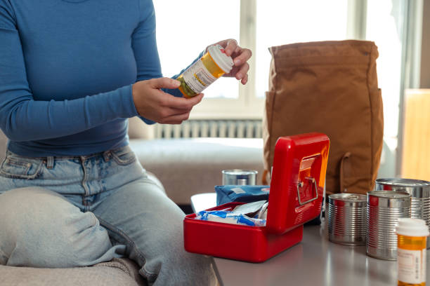 istock Person organizing emergency supplies for doomsday preparedness 2180070546