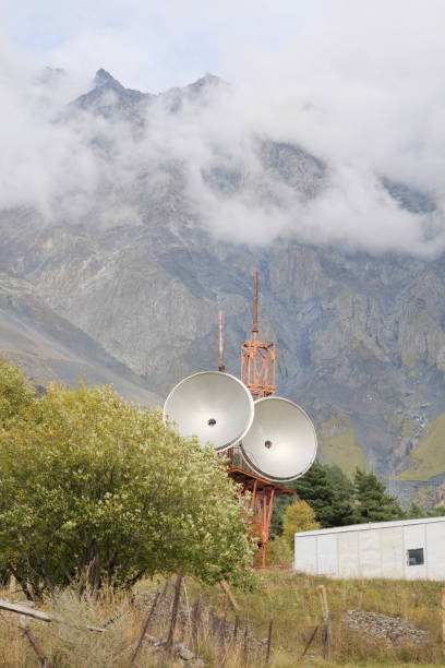 istock Telecommunications satellite dish radio telescope in mountains. Earth based astronomical locator 2180070993