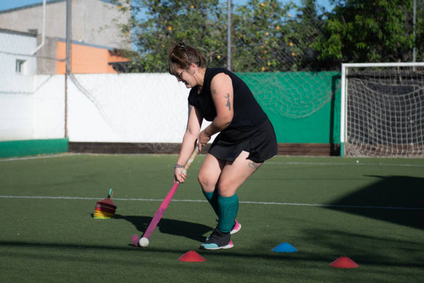 istock Woman playing Mommy hockey 2180074325