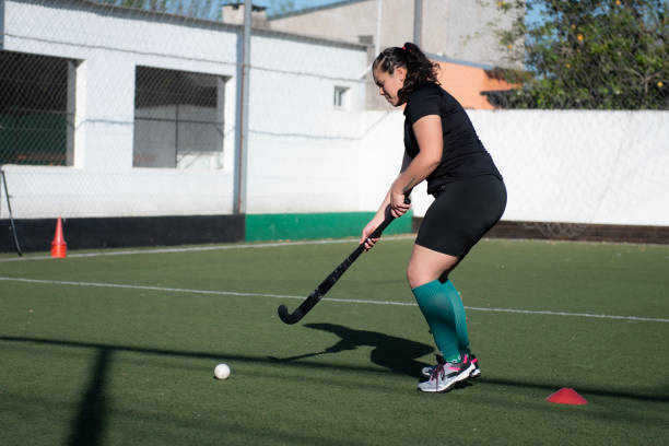 istock Woman playing Mommy hockey 2180074449