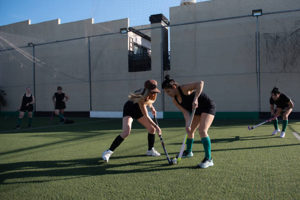 istock Women playing a hockey match 2180074502