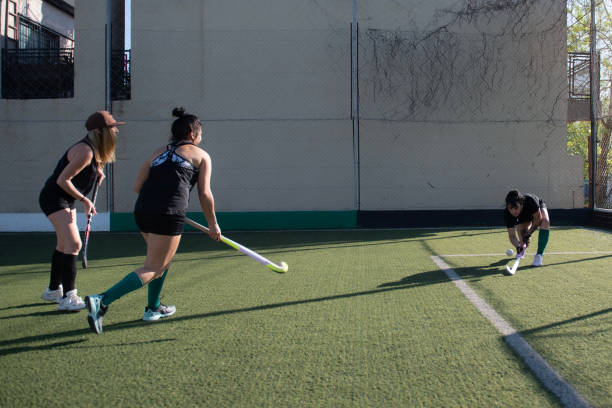 istock Women playing a hockey match 2180074512
