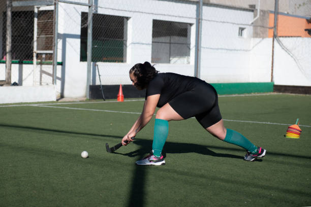 istock Woman playing Mommy hockey 2180074530