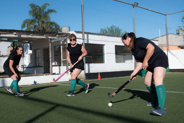 istock Women playing a hockey match 2180074608