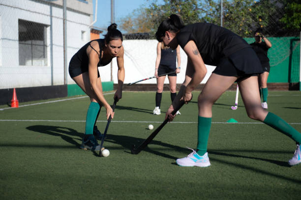 istock Women playing a hockey match 2180074616