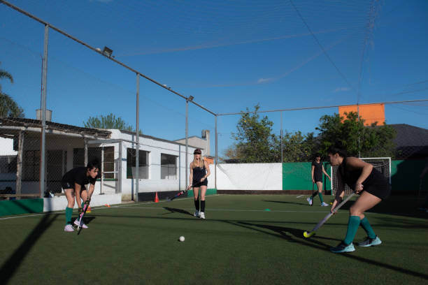 istock Women playing a hockey match 2180074648