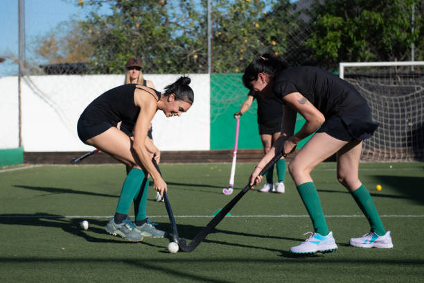 istock Women playing a hockey match 2180074653