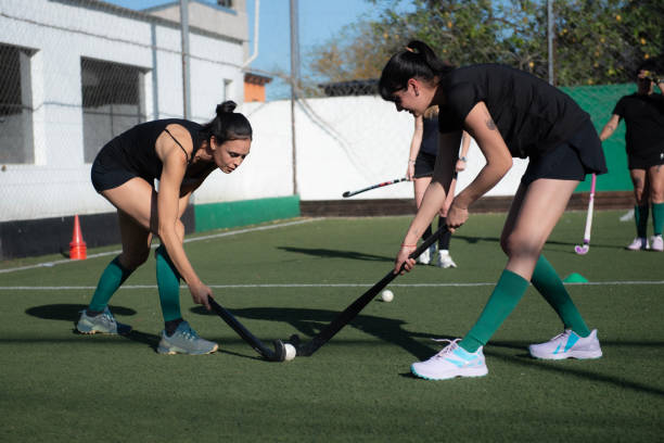 istock Women playing a hockey match 2180074669