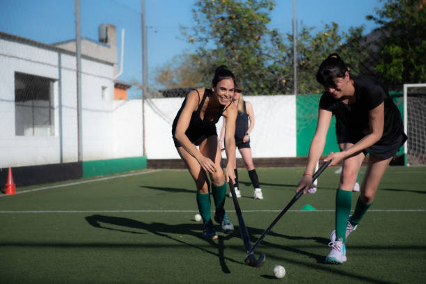 istock Women playing a hockey match 2180074670