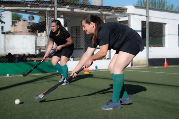 istock Women playing a hockey match 2180074723