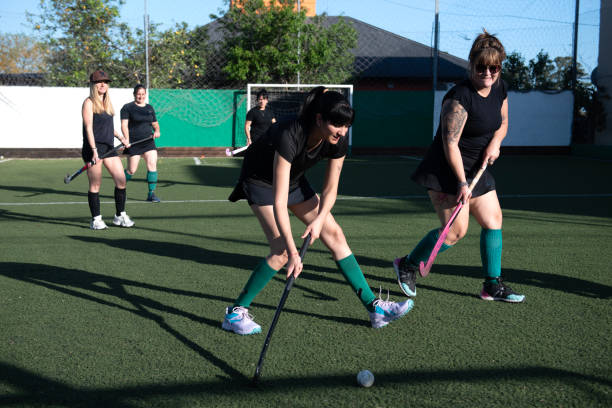 istock Women playing a hockey match 2180075049