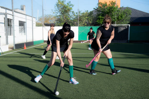 istock Women playing a hockey match 2180075169