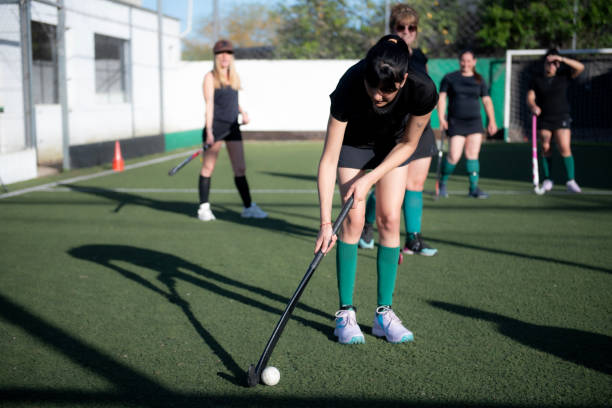 istock Women playing a hockey match 2180075257