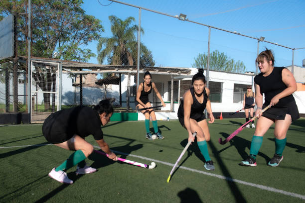 istock Women playing a hockey match 2180075327