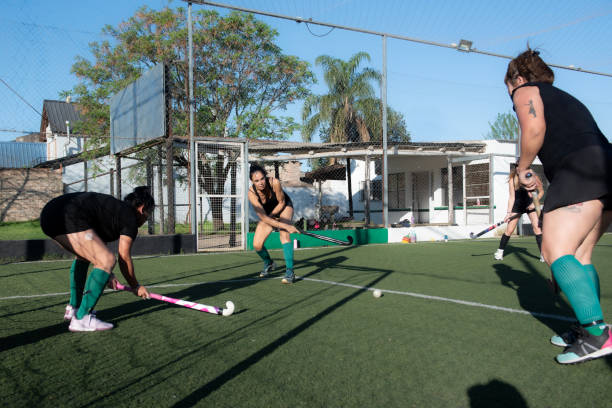 istock Women playing a hockey match 2180075422