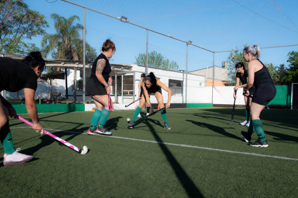 istock Women playing a hockey match 2180075426
