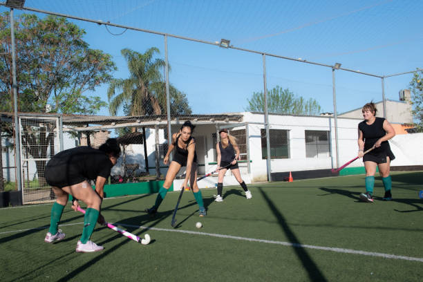 istock Women playing a hockey match 2180075474