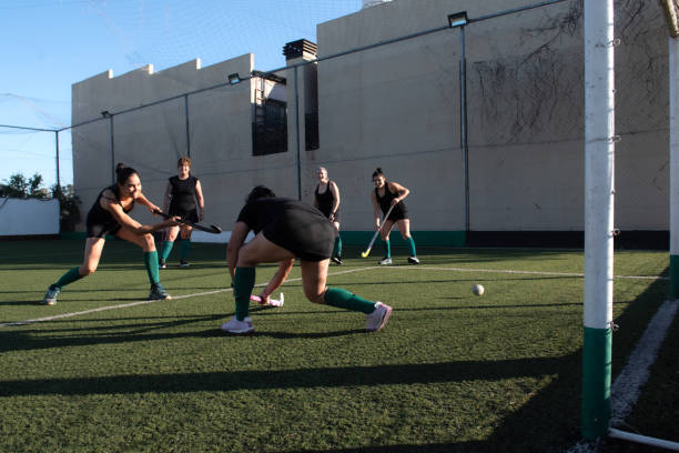 istock Women playing a hockey match 2180075491