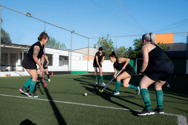 istock Women playing a hockey match 2180075506