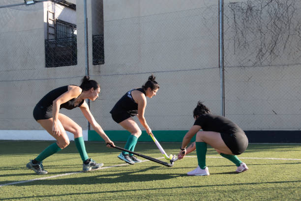 istock Women playing a hockey match 2180075541