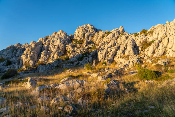The Master's Road, half-asphalted, half-macadam 41-kilometer-long Majstorska cesta in Velebit.  One of the most beautiful tourist attractions in Croatia. Build 200 hundred years ago. Tula's crags are a karst formations on Velebit , their main feature tall pillars and towers, with long grooves carved through them.