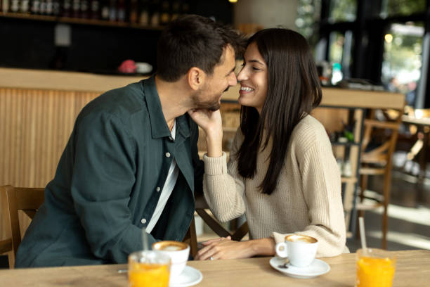 istock Young couple enjoying their time together in a cafe 2180077840