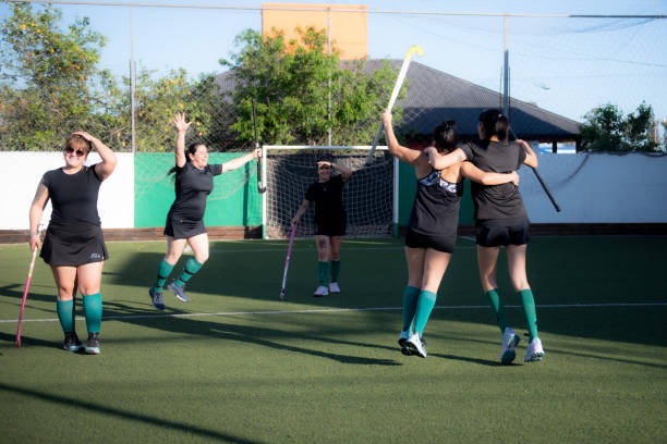 istock Field hockey players celebrating 2180078000