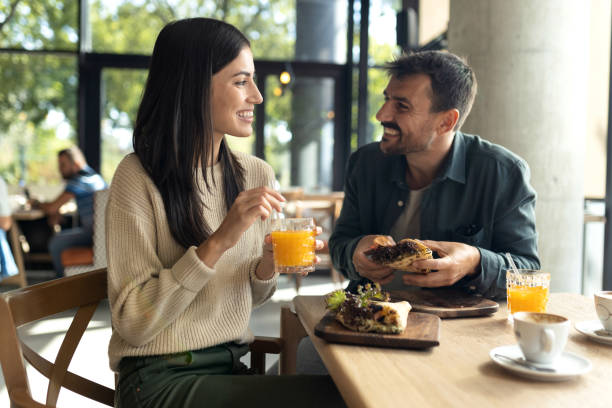 istock Young couple enjoying their time together in a cafe 2180078140