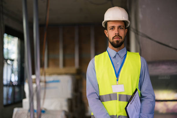 istock Portrait of young builder man on construction 2180078431