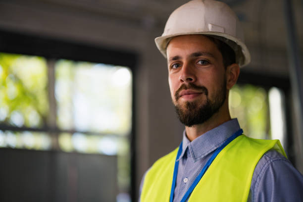 istock Portrait of young builder man on construction 2180078489