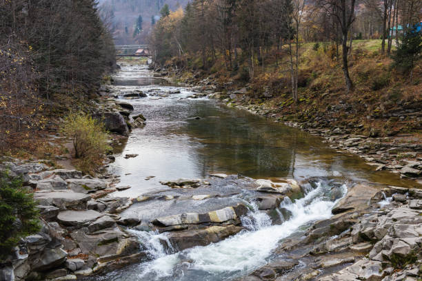 istock Mountain river with stones. Rafting river in forest. Splashy fast river texture. Natural water background 2180081818