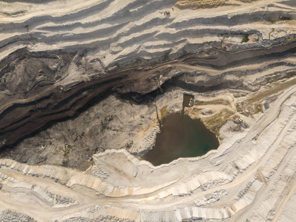 istock Deep opencast coal mine with many spiral roads. Aerial view 2180089934