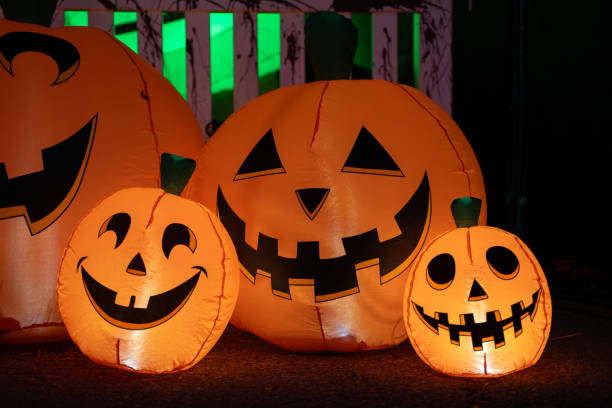 istock Decorated Halloween Jack-o-Lantern Pumpkin at night time. 2180092711