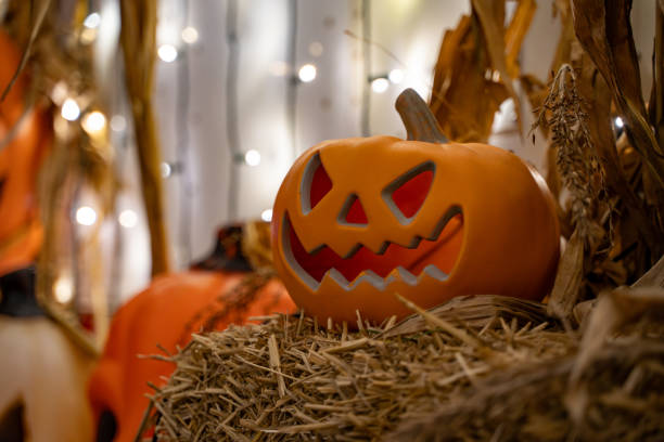 istock Decorated Halloween Jack-o-Lantern Pumpkin at night time. 2180093325