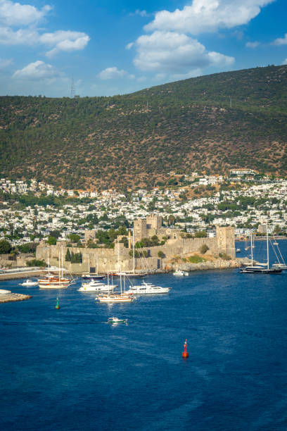 View of Bodrum town from Bitez hills. Bodrum is a coastal town in the Muğla province of Turkey. Bodrum is a holiday resort with the most preferred beaches and hotels for sea holidays in Turkey. Bodrum town is also a holiday resort known for the historical castles and ancient ruins that are intertwined with the town.