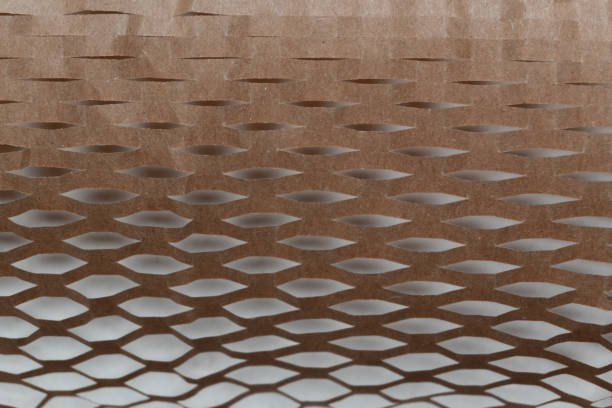 istock Close-up of honeycomb kraft paper, showcasing its unique, eco-friendly structure. 2180094112