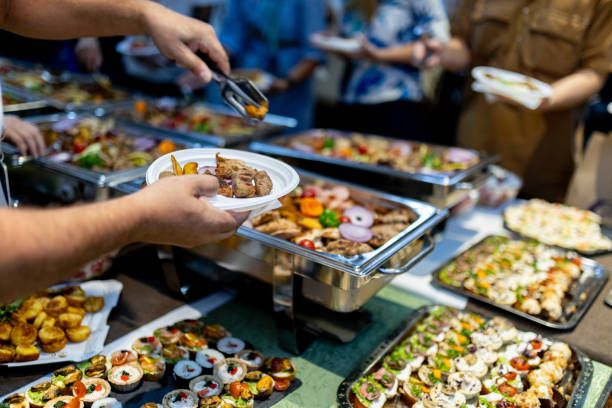 istock Buffet dining experience with diverse food selection during an evening gathering in a festive atmosphere 2180096402
