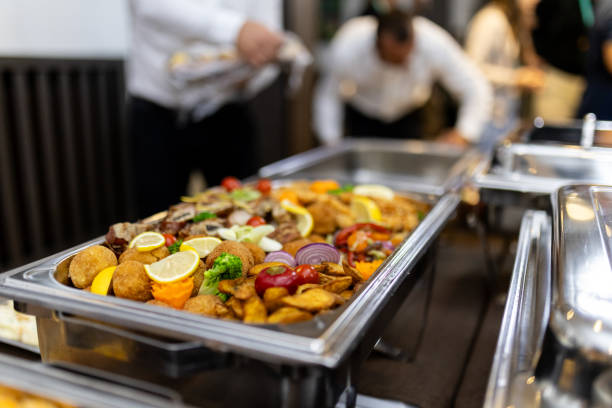 istock Delicious buffet spread with various dishes and colorful garnishes at a gathering during an evening event 2180096411