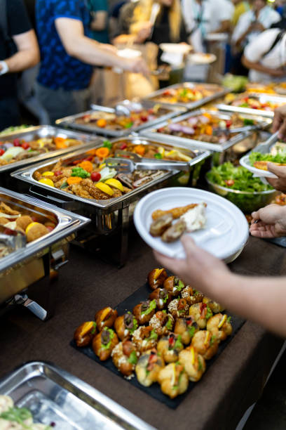 istock Buffet dining experience featuring a variety of dishes at a festive gathering in a vibrant setting during the afternoon 2180096546