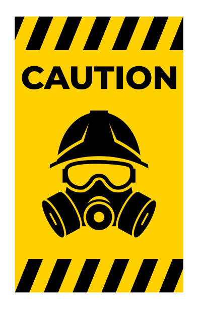 istock Caution Sign with Safety Helmet and Gas Mask Graphic 2180102096