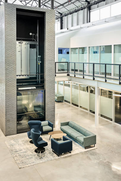 istock Empty lobby of a modern office with sofa and chairs 2180104339