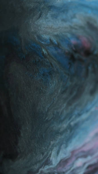 istock Dark paint mix fluid glitter spill black blue wave 2180110547