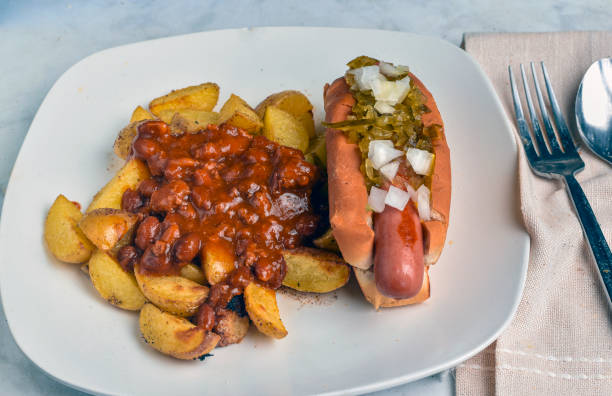 istock hot dog with potato wedges  top with chilli 2180117011
