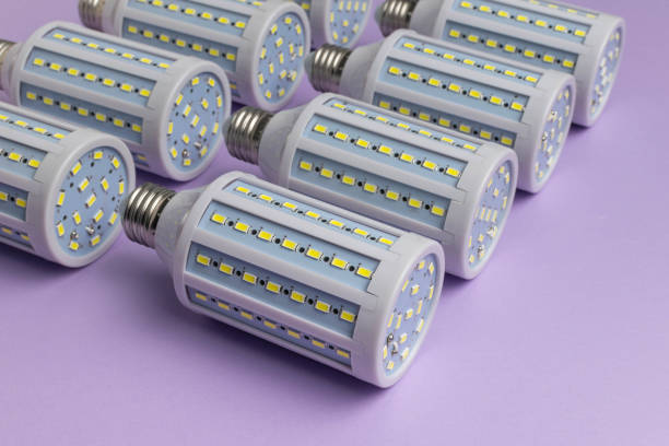 istock Energy-Efficient LED Bulbs on Purple Background Highlighting Modern Lighting Technology 2180119668