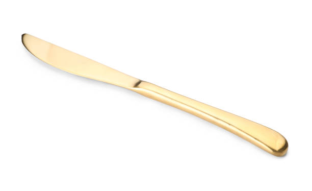 istock One shiny golden knife isolated on white 2180130406