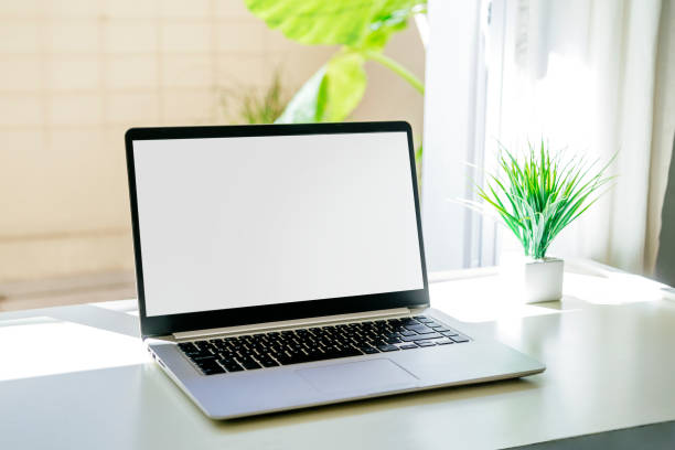 istock Laptop on a desk with white screen for mockup. 2180133153