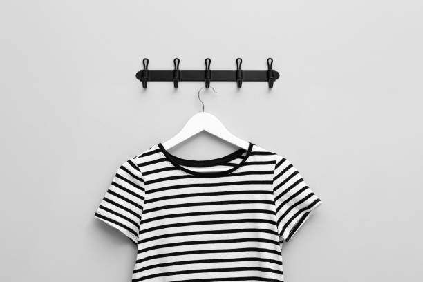 Wood cloth hangers on an industrial cement background